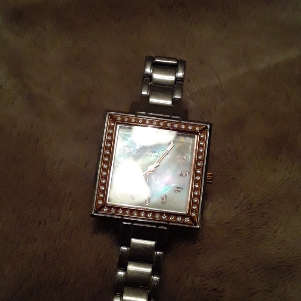 Kenneth Cole silver gold with irradesent face